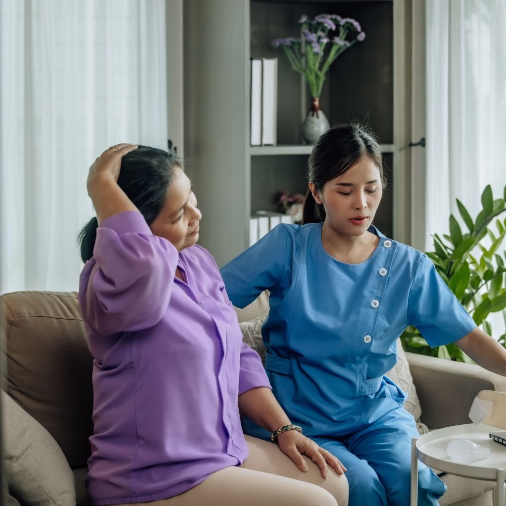 Wellness coach advising a senior | Yoga session for elderly group