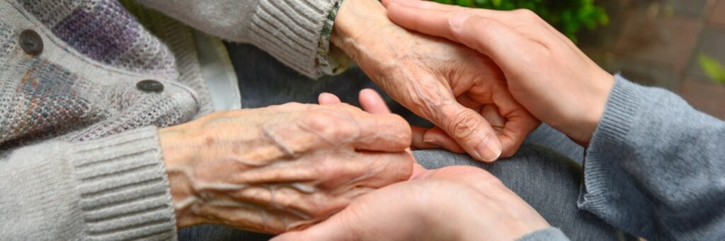 Dementia care for elderly at home – caregiver helping senior