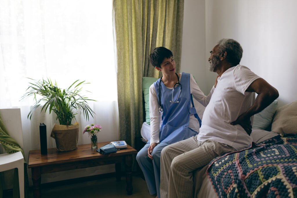 Caregiver helping elderly person at home