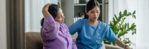 Doctor-supervised home healthcare services in India by Care247 — professional nurse assisting elderly patient at home.