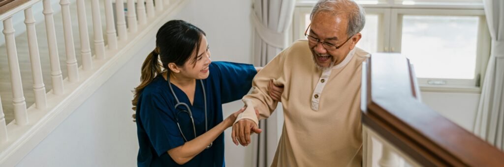 senior citizen care taker helping elderly at home by Care247